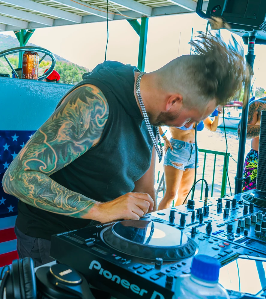 Alex Garcia performing behind the decks as Artefex